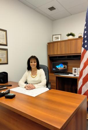 Photo of Sandra J. Ford at her desk
